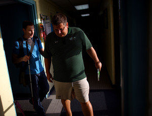 A native of St. Petersburg, Fla., Snyder was captain of the swim team at the U.S. Naval Academy, where he graduated in 2006. Here, he walks with his coach at his training center in Baltimore.