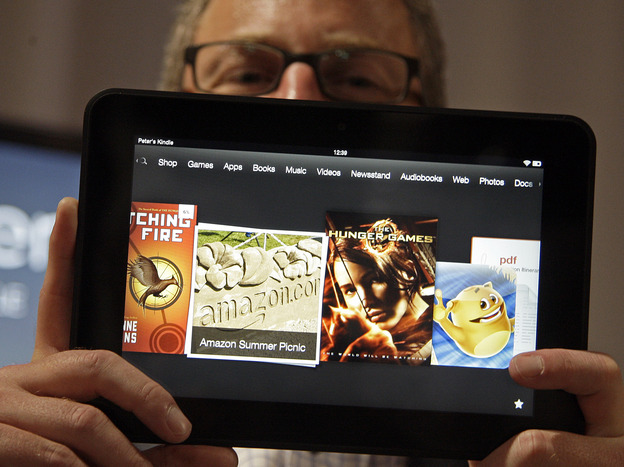 Amazon Kindle vice president Peter Larsen holds the Kindle Fire HD at the introduction of the new tablet in Santa Monica, Calif., on Thursday.