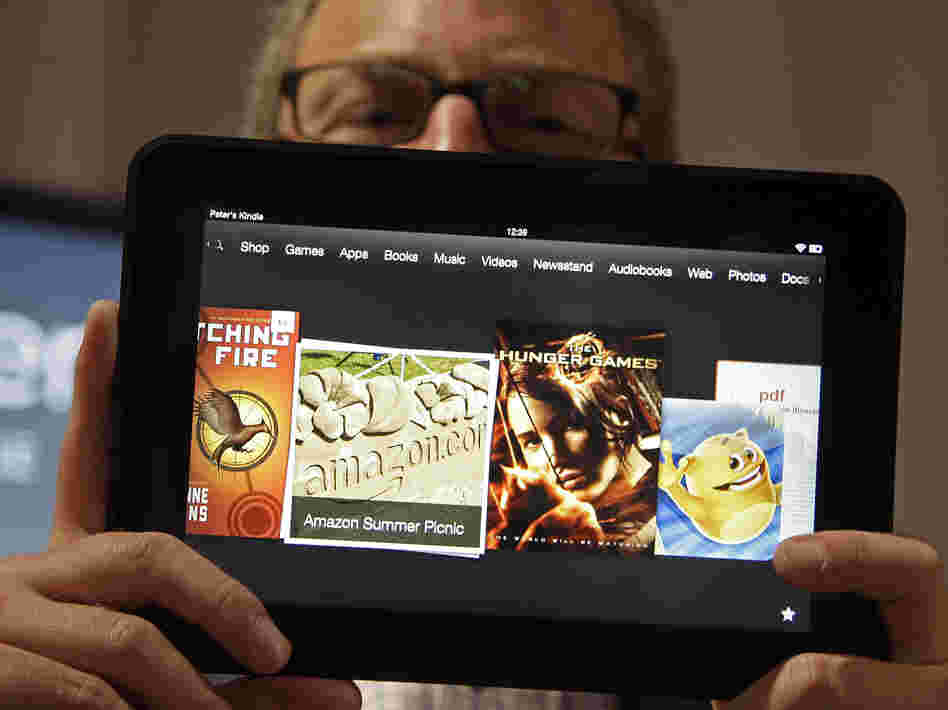 Amazon Kindle vice president Peter Larsen holds the Kindle Fire HD at the introduction of the new tablet in Santa Monica, Calif., on Thursday.
