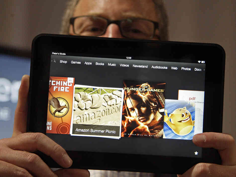 Amazon Kindle vice president Peter Larsen holds the Kindle Fire HD at the introduction of the new tablet in Santa Monica, Calif., on Thursday.