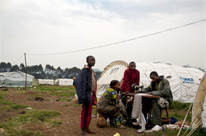 A Congolese man who fled eastern Congo for shelter at a Ugandan refugee camp lugged his sewing machine with him. U.N. officials say tens of thousands have fled for Uganda and Rwanda in recent months. A Congolese man who fled eastern Congo for shelter at a Ugandan refugee camp lugged his sewing machine with him. U.N. officials say tens of thousands have fled for Uganda and Rwanda in recent months.