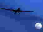 A U.S. Predator drone flies through the night sky over Kandahar Air Field in Afghanistan. Such drones have been targeting groups such as the Haqqani network that are accused of attacking U.S. and Afghan forces.