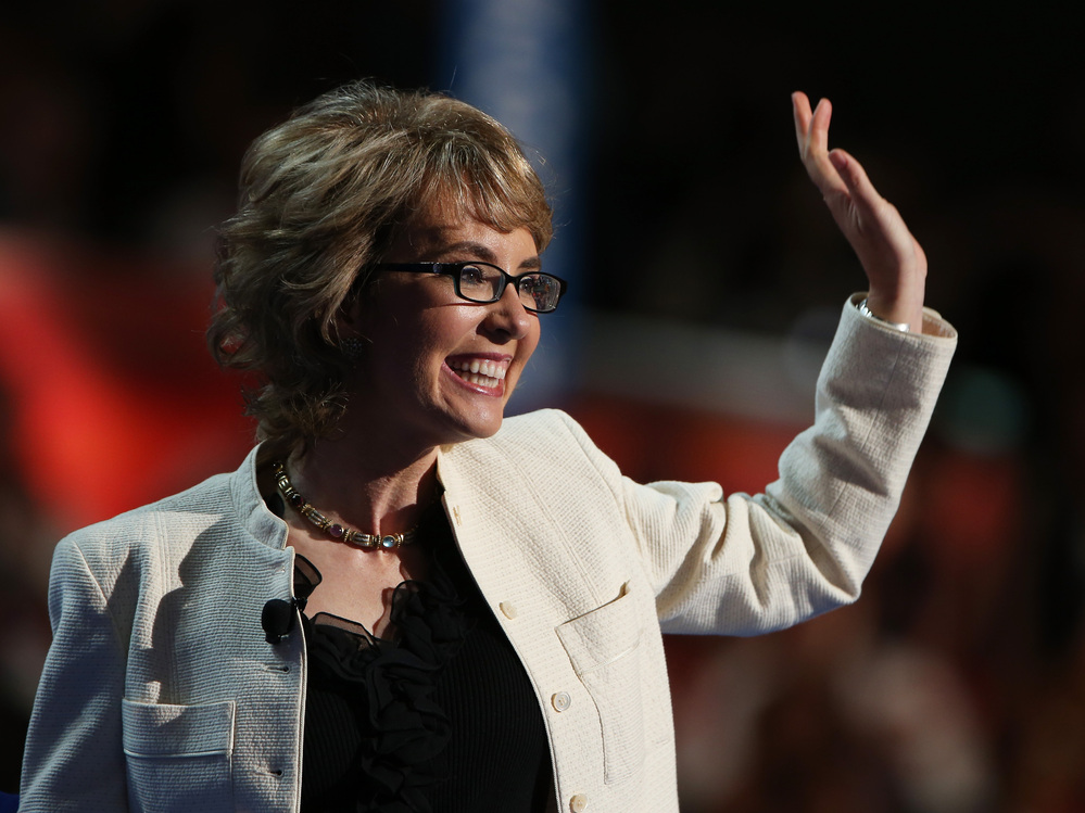 Former Rep. Gabrielle Giffords, D-Ariz., waves to the delegates at the Democratic National Convention.