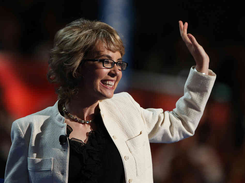 Former Rep. Gabrielle Giffords, D-Ariz., waves to the delegates at the Democratic National Convention.