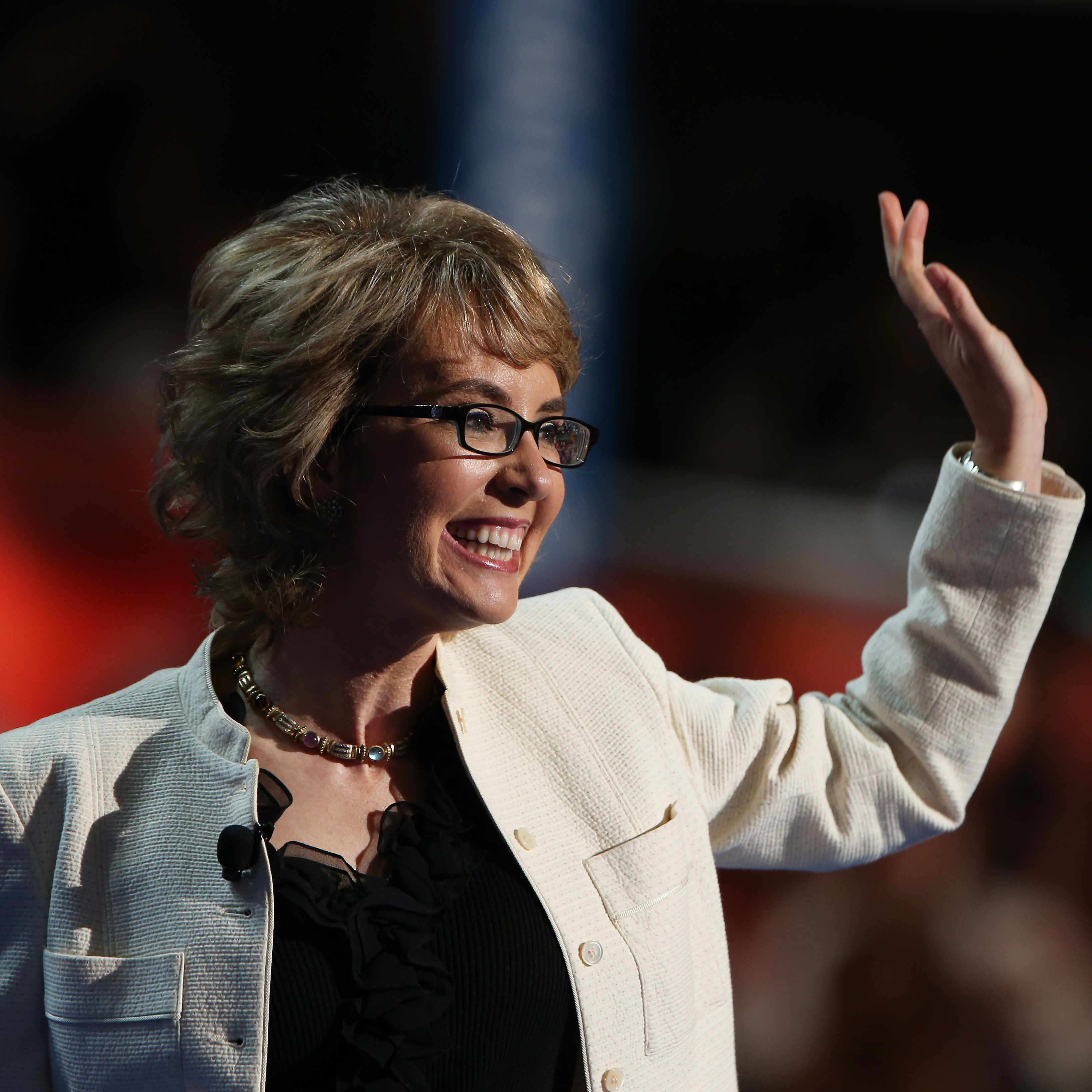Former Rep. Gabrielle Giffords, D-Ariz., waves to the delegates at the Democratic National Convention.