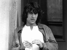 Robert De Niro leaning against a wall in a scene from Martin Scorsese's Mean Streets. Robert De Niro leaning against a wall in a scene from Martin Scorsese's Mean Streets.