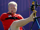 Archer Matt Stutzman of the U.S. prepares to shoot in the London Paralympics. Born without arms, Stutzman uses a release trigger strapped to his shoulder to fire. Archer Matt Stutzman of the U.S. prepares to shoot in the London Paralympics. Born without arms, Stutzman uses a release trigger strapped to his shoulder to fire.