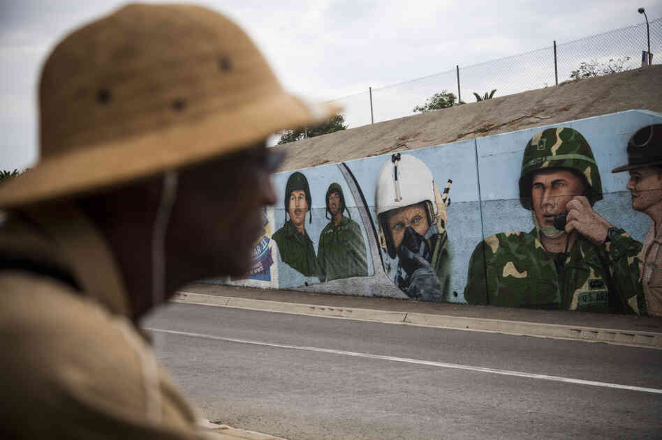 R.W. Williams, 63, a Vietnam veteran, has been seeking medical treatment for a host of ailments, including PTSD, at the VA health center in Los Angeles. He is seen here on the campus near a mural honoring soldiers.