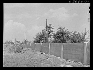 The concrete wall separating the black and white sections of Detroit is seen in 1941.