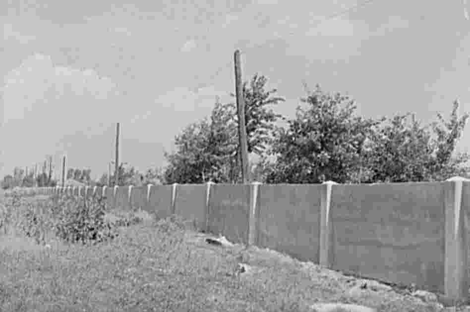 The concrete wall separating the black and white sections of Detroit is seen in 1941.