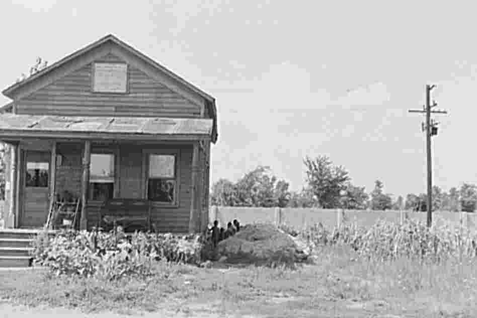 A house in the black section of Detroit in 1941, abutting the wall.