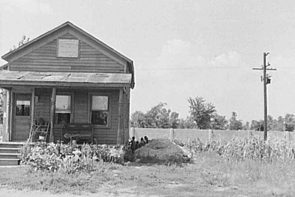 A house in the black section of Detroit in 1941, abutting the wall.