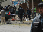 Afghan police carry the remains of a suicide attack victim in the Kabul's diplomatic quarters, home to many Western embassies, on Saturday. Afghan police carry the remains of a suicide attack victim in the Kabul's diplomatic quarters, home to many Western embassies, on Saturday.