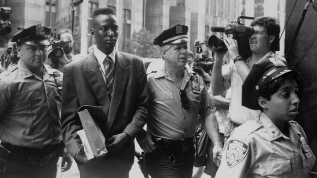 Yusef Salaam is escorted by police.