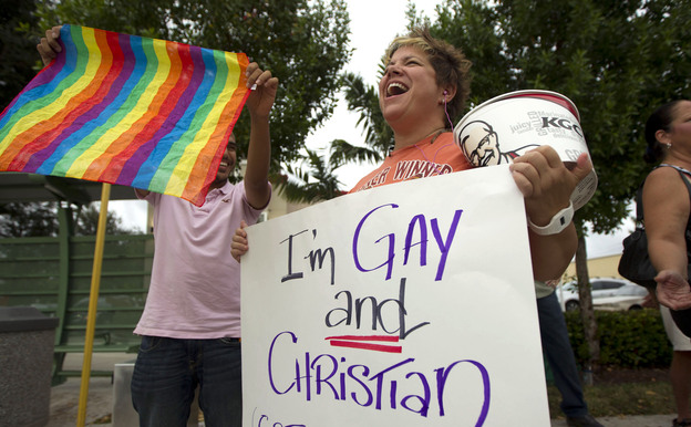 Carri Jo Anderson joins the protest in front of a Chick-fil-A restaurant in Pompano Beach, Fla., in August. As views on homosexuality change, more states are challenging the federal definition of marriage