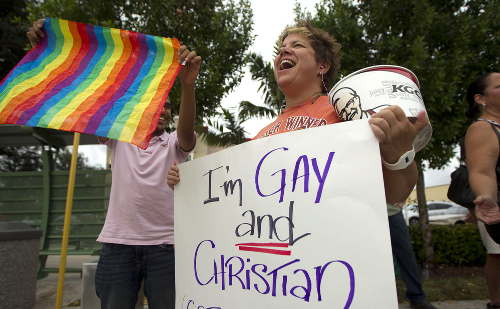 Carri Jo Anderson joins the protest in front of a Chick-fil-A restaurant in Pompano Beach, Fla., in August. As views on homosexuality change, more states are challenging the federal definition of marriage