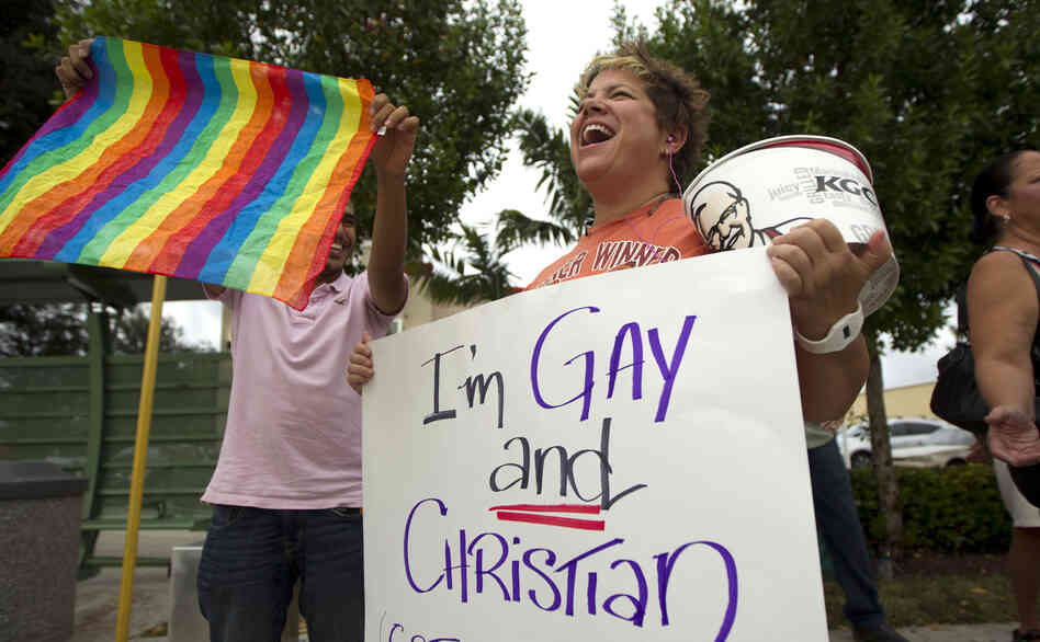 Carri Jo Anderson joins the protest in front of a Chick-fil-A restaurant in Pompano Beach, Fla., in August. As views on homosexuality change, more states are challenging the federal definition of marriage