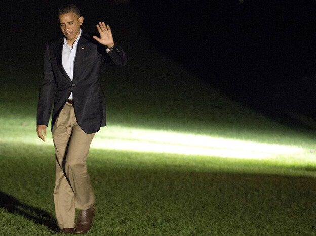 President Barack Obama waves as he returns to the White House on September 9, 2012. Obama spent the day on a campaign trip through Florida.