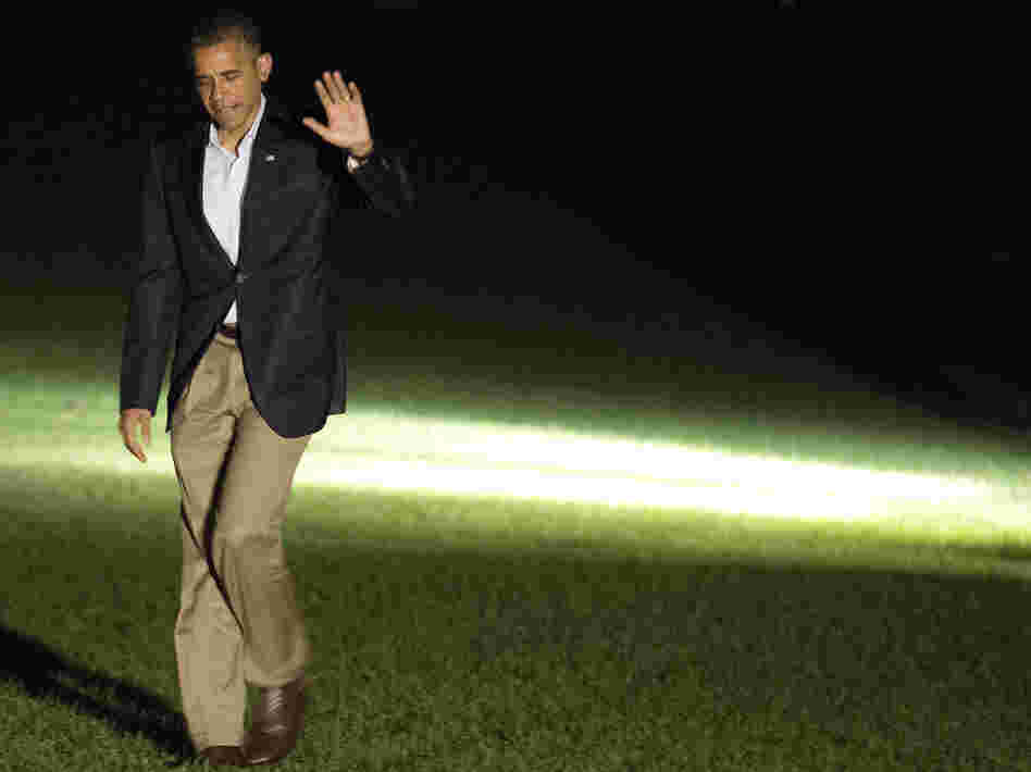 President Barack Obama waves as he returns to the White House on September 9, 2012. Obama spent the day on a campaign trip through Florida.