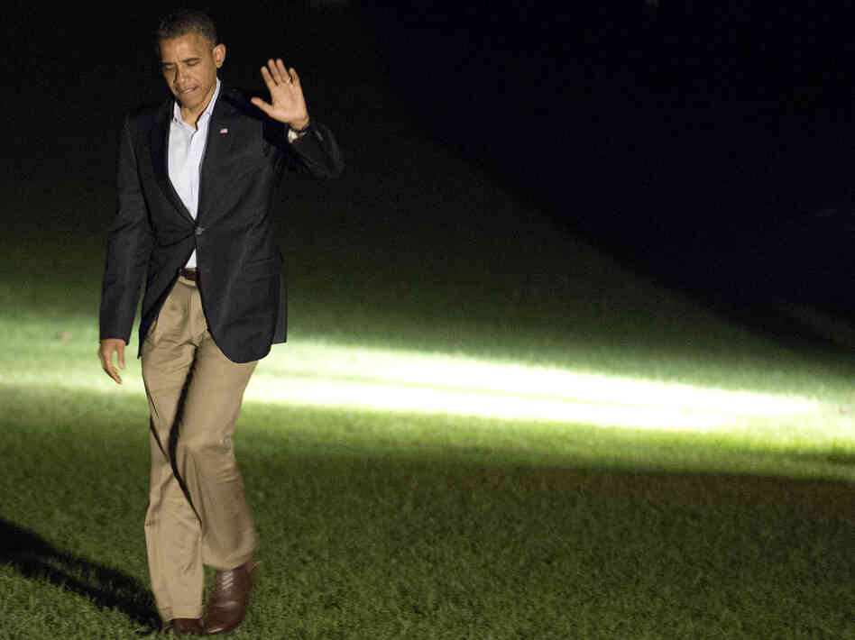 President Barack Obama waves as he returns to the White House on September 9, 2012. Obama spent the day on a campaign trip through Florida.