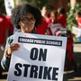 Chicago public school teachers picket outside William H.Wells Community High School on Monday. Chicago public school teachers picket outside William H.Wells Community High School on Monday.