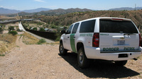 A Border Patrol vehicle patrols the fence separating the cities of Nogales, Ariz., and Nogales, Sonora. The fence has been rebuilt twice.