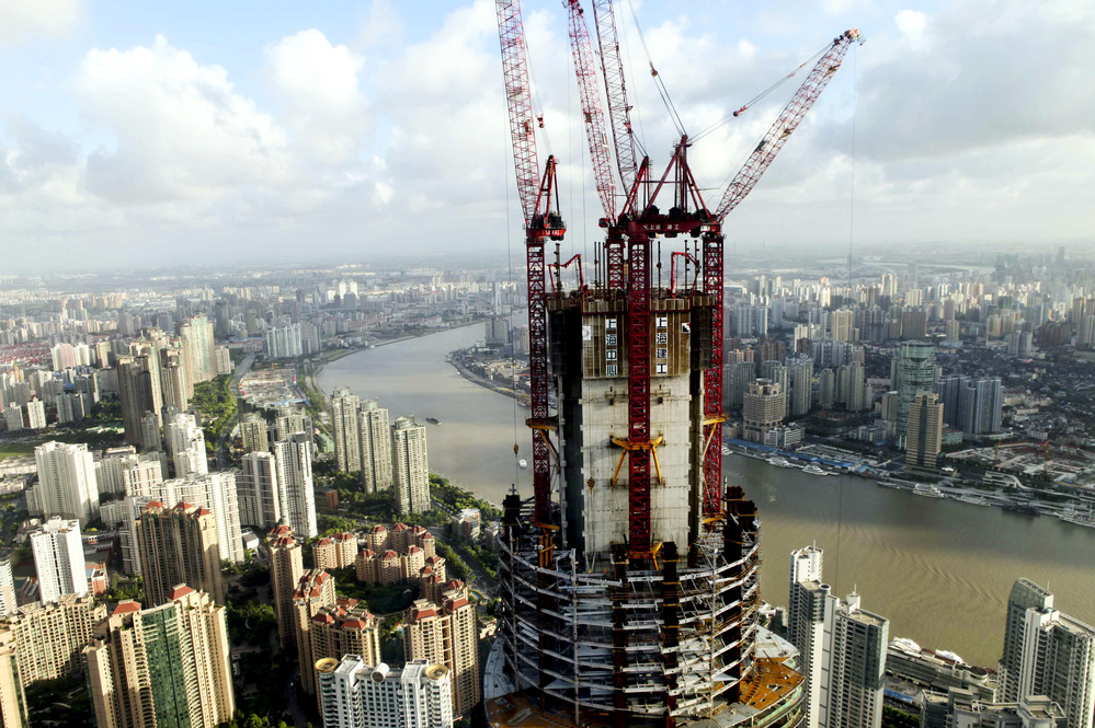 China's growing economic might means that it has increasing power to push back against US policies that it does not like, according to analysts. This photo from August shows the construction on the Shanghai Tower, which will be the tallest building in Shanghai.