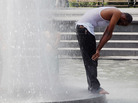A man stands in a fountain in Washington Square Park on July 18, in New York City. Temperatures were expected in the upper 90's during another heat wave in the city. A man stands in a fountain in Washington Square Park on July 18, in New York City. Temperatures were expected in the upper 90's during another heat wave in the city.