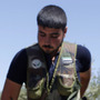 Rebel fighters take up position near the military airport outside the rebel-held town of Azaz in northern Syria on Aug. 21. In rebel-held towns like Azaz, activists are taking on new, risky roles as the uprising against Syrian President Bashar Assad continues.