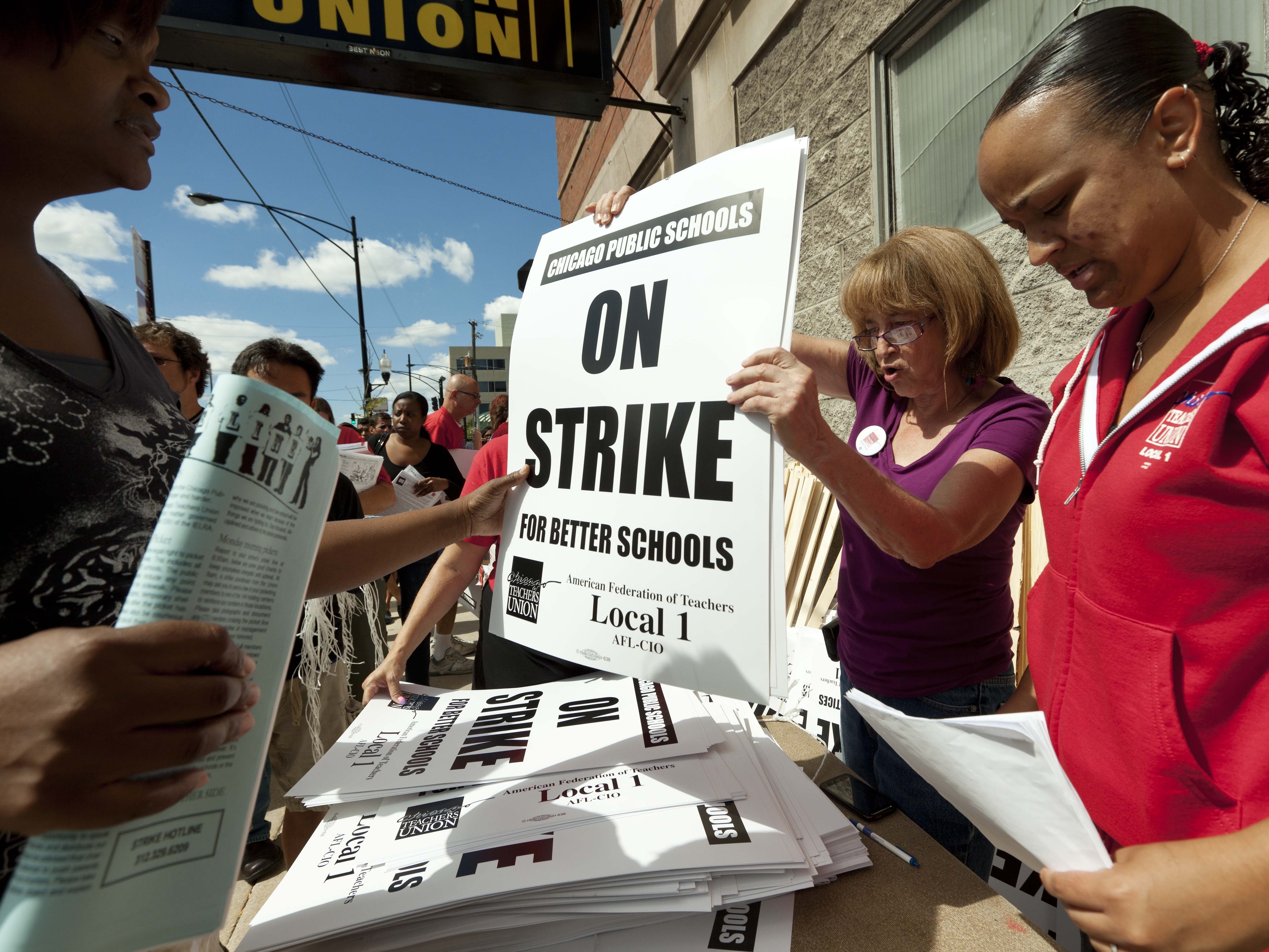 Members of the Chicago Teachers Union distribute strike signage at the Chicago Teachers Union strike headquarters on Saturday, Sept. 8, 2012 in Chicago.