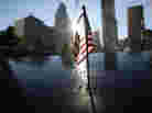 A flag sits atop one of the memorial panels at the World Trade Center site in New York City on Tuesday. A flag sits atop one of the memorial panels at the World Trade Center site in New York City on Tuesday.