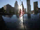 A flag sits atop one of the memorial panels at the World Trade Center site in New York City on Tuesday.