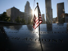 A flag sits atop one of the memorial panels at the World Trade Center site in New York City on Tuesday. A flag sits atop one of the memorial panels at the World Trade Center site in New York City on Tuesday.