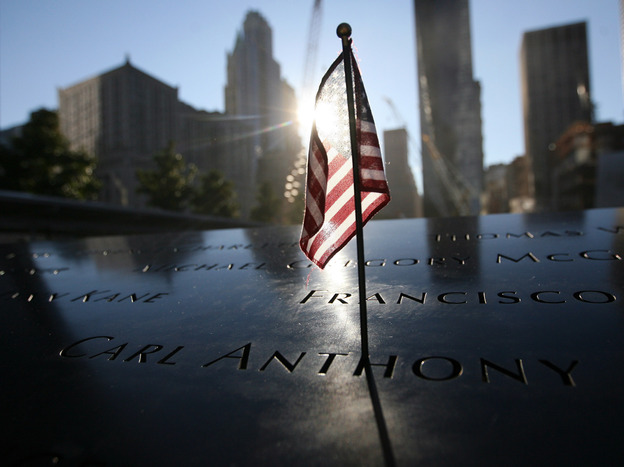 A flag sits atop one of the memorial panels at the World Trade Center site in New York City on Tuesday.