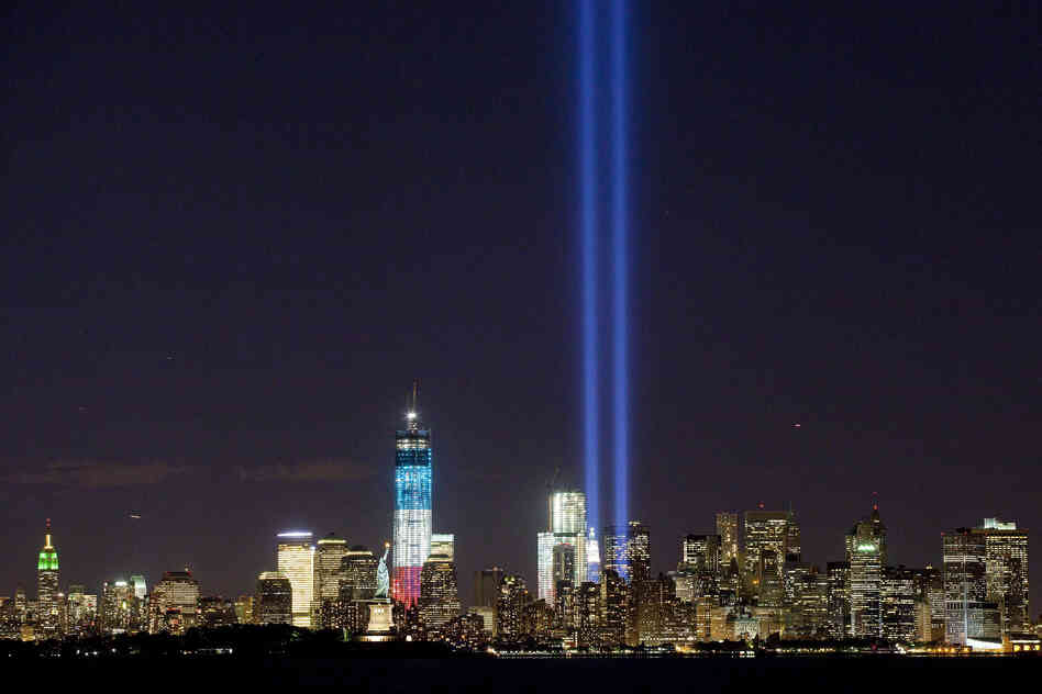 The Tribute in Light shines above the World Trade Center and the Statue of Liberty on Monday as seen from Bayonne, N.J. Tuesday marks the 11th anniversary of the attack that destroyed the twin towers.