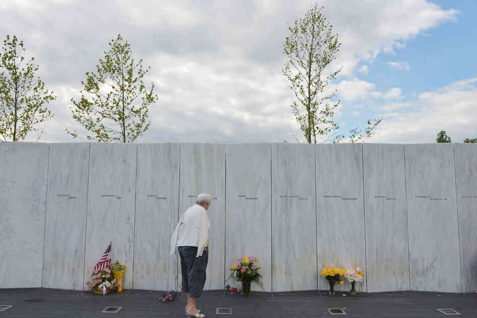 A woman looks at flowers at the Flight 93 National Memorial on Monday ahead of the anniversary of the Sept. 11 attacks in Shanksville, Pa.