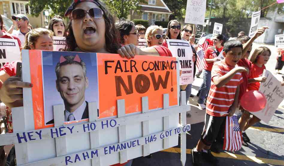 Striking Chicago Public School teacher Lanessa Mendoza pickets with fellow teachers Monday as Mayor Rahm Emanuel visits students staying at Maranatha Church in Chicago during the strike. Striking Chicago Public School teacher Lanessa Mendoza pickets with fellow teachers Monday as Mayor Rahm Emanuel visits students staying at Maranatha Church in Chicago during the strike.