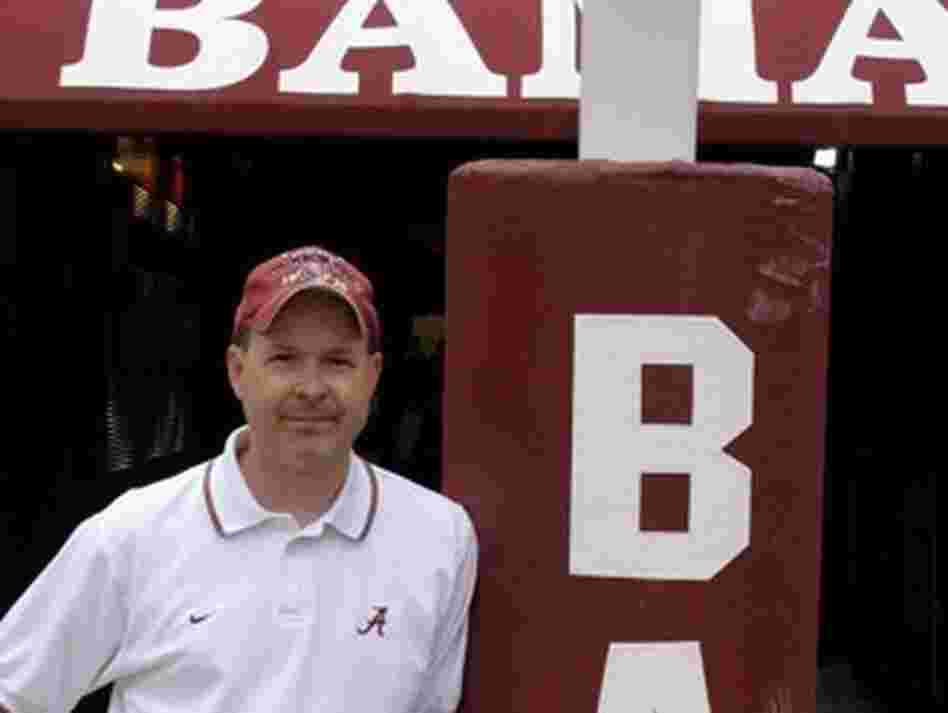 Monique Fields, an unofficial, unpaid football assistant, snapped this picture of her husband, Ken, standing at the goalpost at Bryant-Denny Stadium. Monique Fields, an unofficial, unpaid football assistant, snapped this picture of her husband, Ken, standing at the goalpost at Bryant-Denny Stadium.