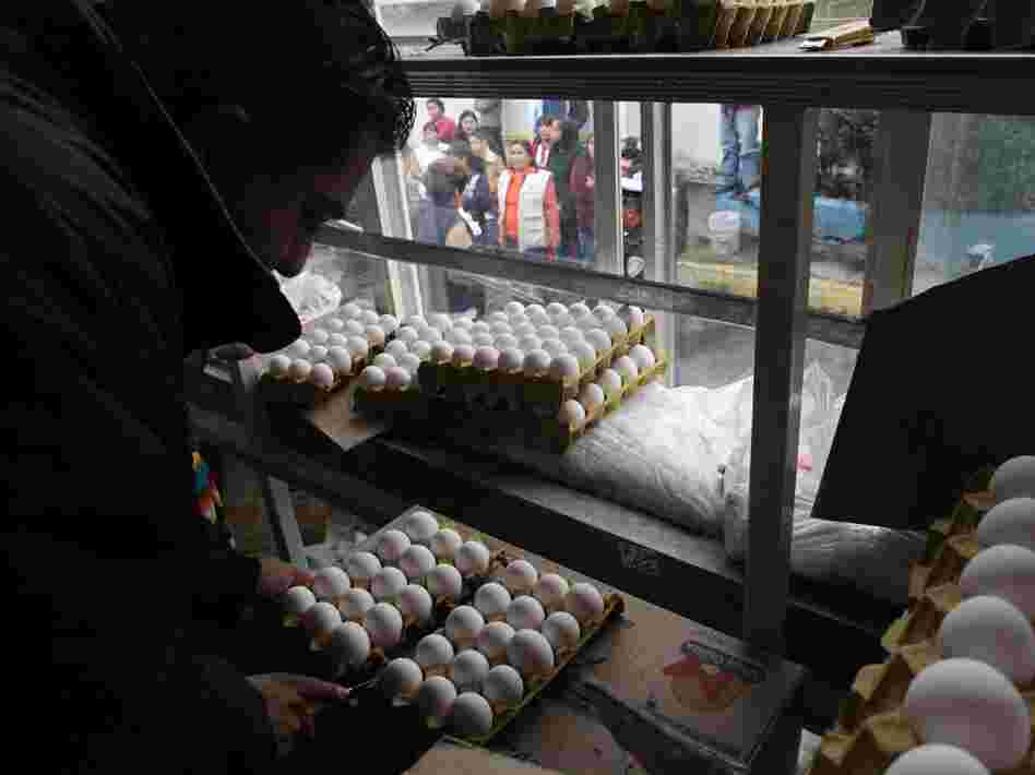 A city worker sells eggs as people line up outside the truck in Mexico City on Aug. 24. The Mexican government is battling an egg shortage that has caused prices to spike in a country with the highest per-capita egg consumption on Earth.