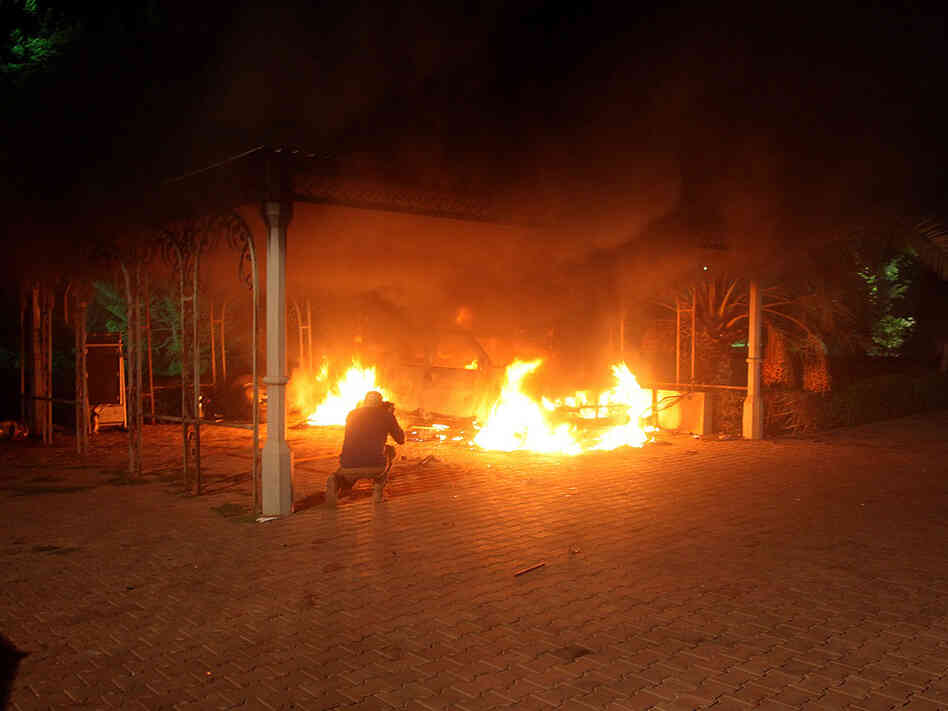 A vehicle and the surrounding area are engulfed in flames after it was set on fire inside the U.S. consulate compound in Benghazi late on September 11, 2012. An armed mob protesting over a film they said offended Islam, attacked the U.S. consulate in Benghazi and set fire to the building.