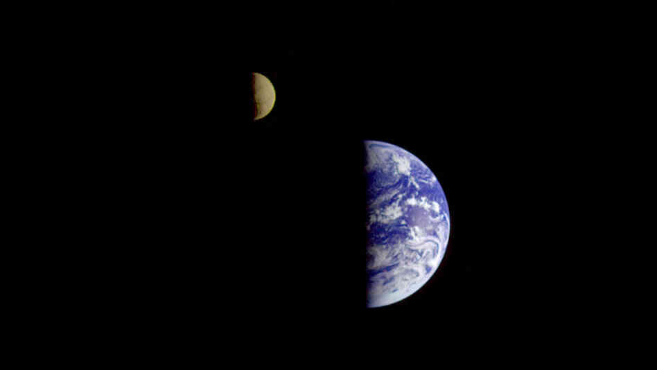 On its way to Jupiter, the Galileo spacecraft looked back and captured this remarkable view of Earth and the moon. The image was taken from a distance of about 3.9 million miles.