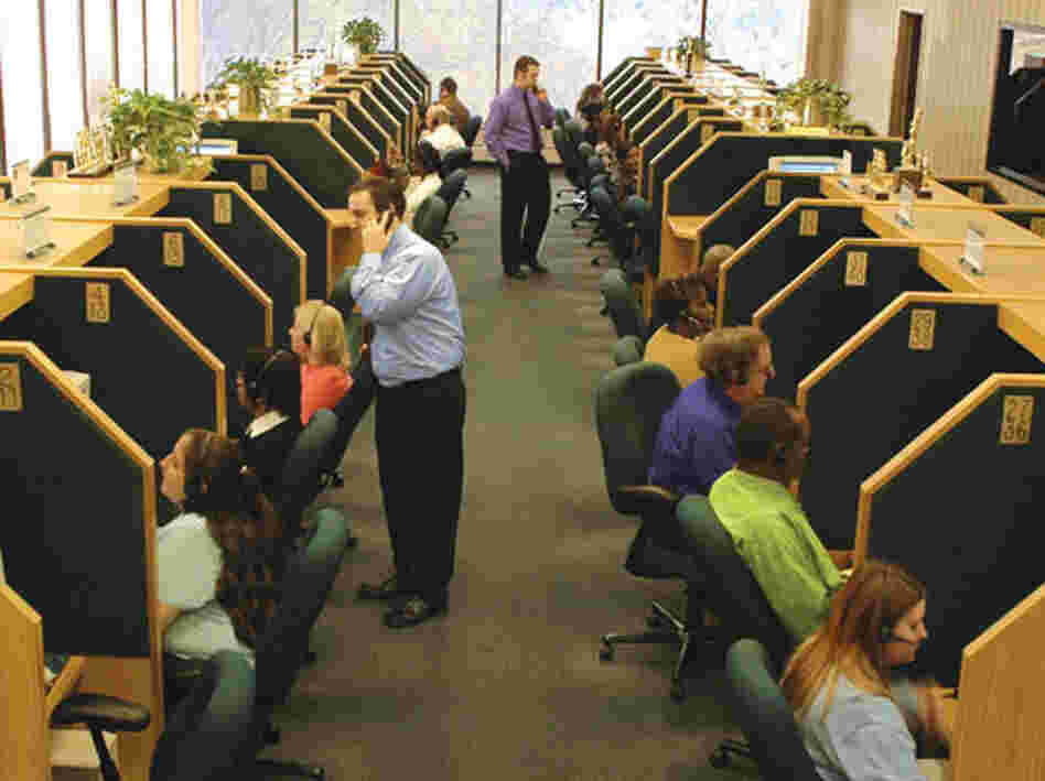 Telemarketers at work at an InfoCision call center. The for-profit company solicits millions in charitable donations each year and also provides marketing services to for-profit clients.
