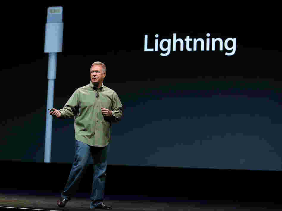 Philip Schiller of Apple announces the Lightning connector during an event to unveil the new iPhone 5 in San Francisco on Wednesday.