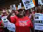 Chicago public school teachers and their supporters picket in front of the Chicago Public Schools headquarters.