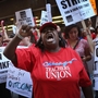 Chicago public school teachers and their supporters picket in front of the Chicago Public Schools headquarters. Chicago public school teachers and their supporters picket in front of the Chicago Public Schools headquarters.