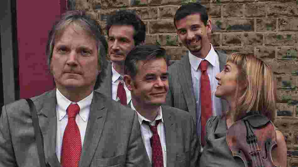 Find the One is the latest album by the alt-bluegrass act The Coal Porters, led by Sid Griffin (far left).
