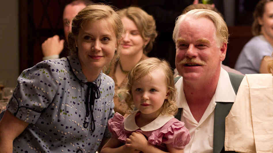 In Paul Thomas Anderson's The Master, Amy Adams plays Peggy Dodd, the spouse of a charismatic spiritual leader, played by Philip Seymour Hoffman. Adams says her character is smart and educated but feels "more powerful behind a man than in front of a man." In Paul Thomas Anderson's The Master, Amy Adams plays Peggy Dodd, the spouse of a charismatic spiritual leader, played by Philip Seymour Hoffman. Adams says her character is smart and educated but feels "more powerful behind a man than in front of a man."