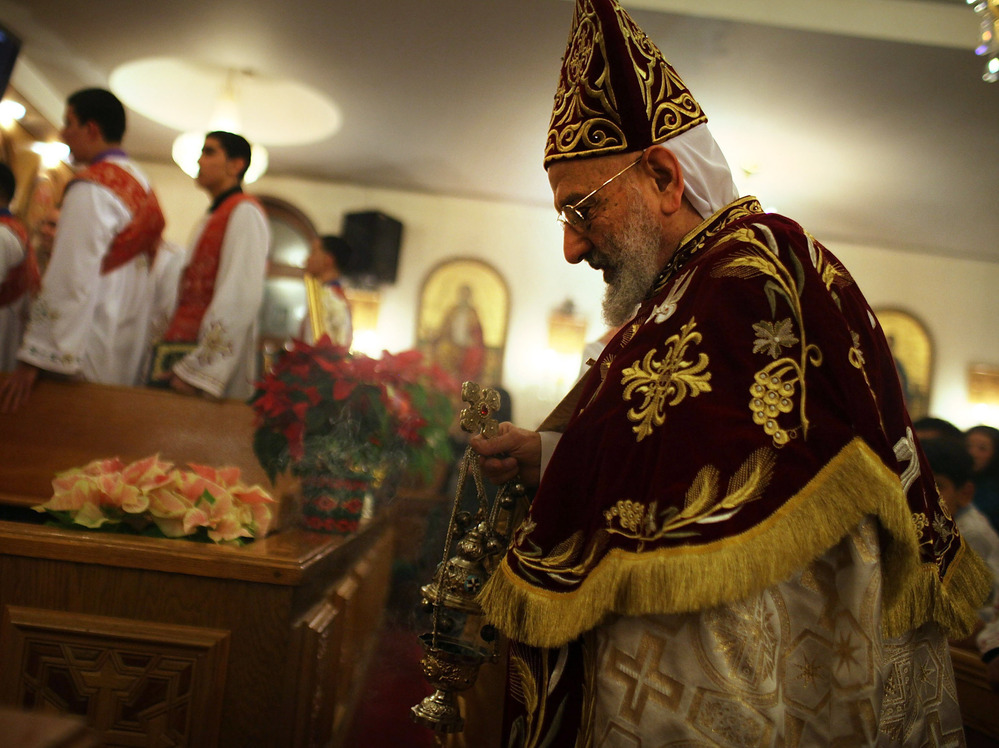 Father Mina celebrates the Christmas Nativity Liturgy, the start of Christmas, at the Coptic Orthodox Church of St. George on Jan. 6 in Brooklyn, N.Y. Coptic churches around the country have witnessed a surge of Christians fleeing Egypt since the start of the Arab Spring.
