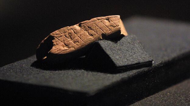 A piece of red ochre with a deliberately engraved design is pictured here at Cape Town's Iziko/South African Museum in 2002. The piece was discovered in Blombos Cave near Stilbaai, about 300 kilometers from Cape Town.