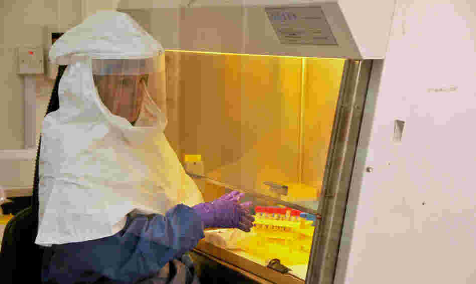 A medical worker from the U.S. Centers for Disease Control and Prevention works at the laboratory in Uganda where Ebola specimens were tested at the start of the latest outbreak in the Democratic Republic of Congo.